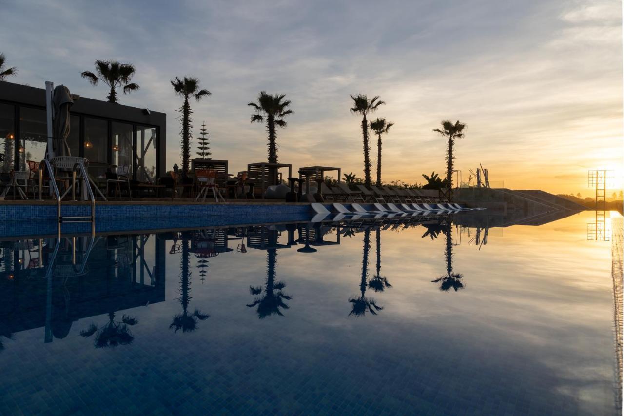 Pullman Mazagan Royal Golf & Spa El Jadida Kültér fotó Sunset at the pool
